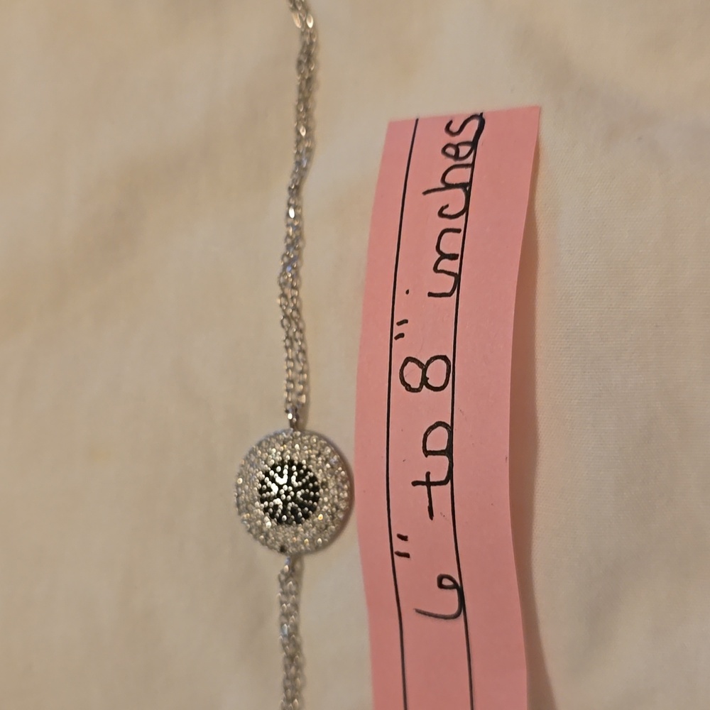 Pave diamond and saphire sterling silver evil eye bracelet.